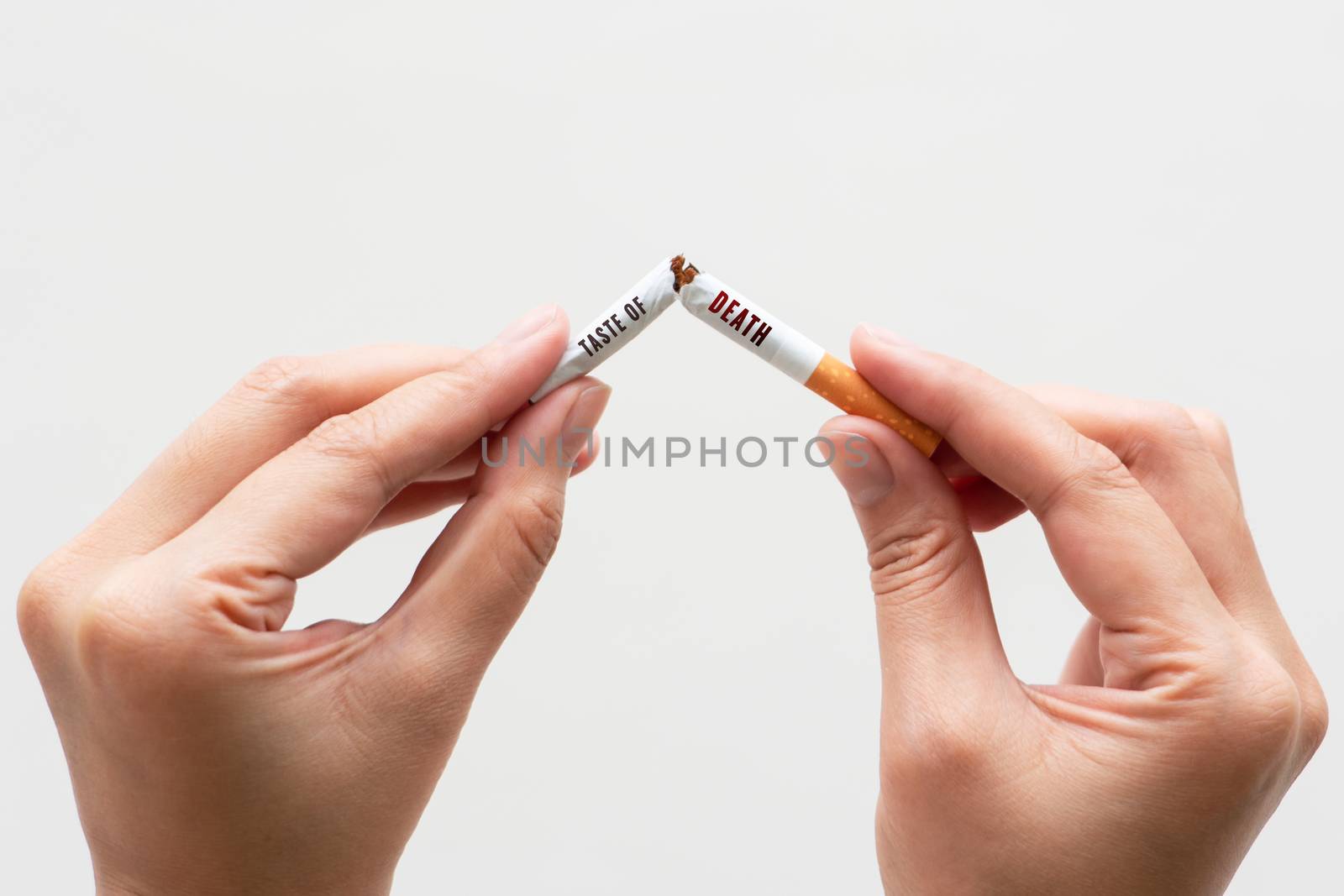 Quit smoking, no tobacco day, woman hands breaking the cigarette