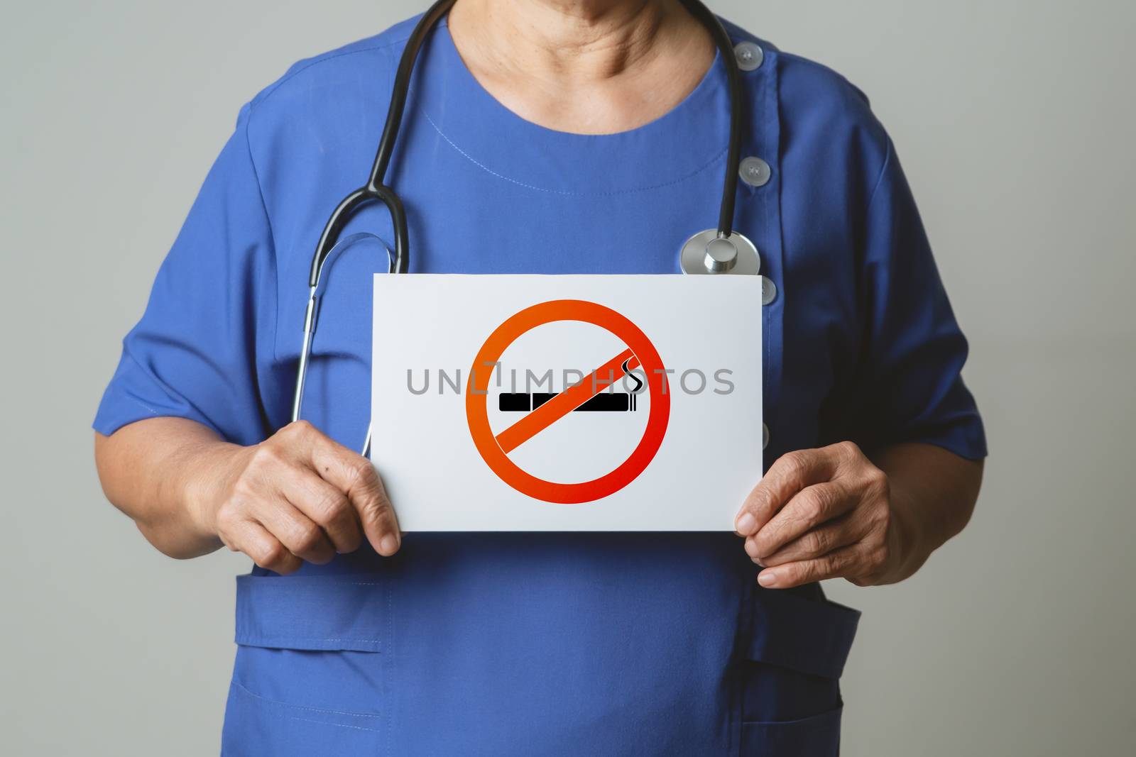 Quit smoking, no tobacco day, doctor holding no smoking sign by psodaz