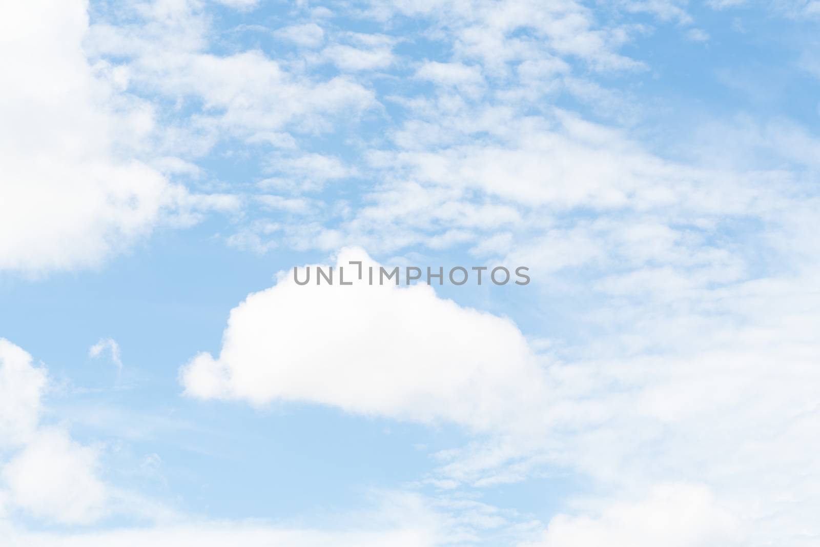 white soft cloud texture on blue sky backdrop