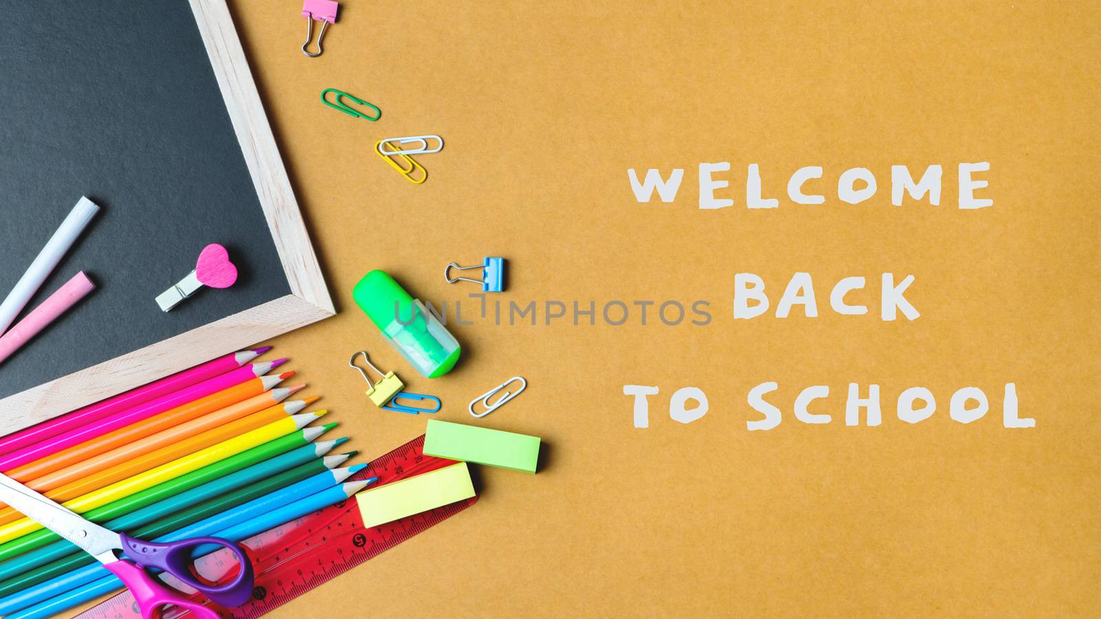 School supplies on black board background. Back to school concept