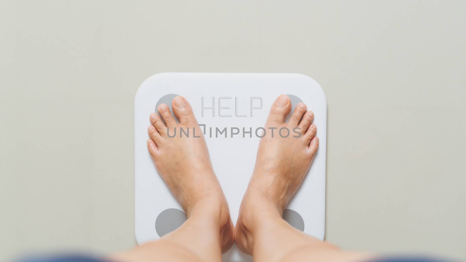 Overweight female is standing on white scales at home with HELP  by psodaz