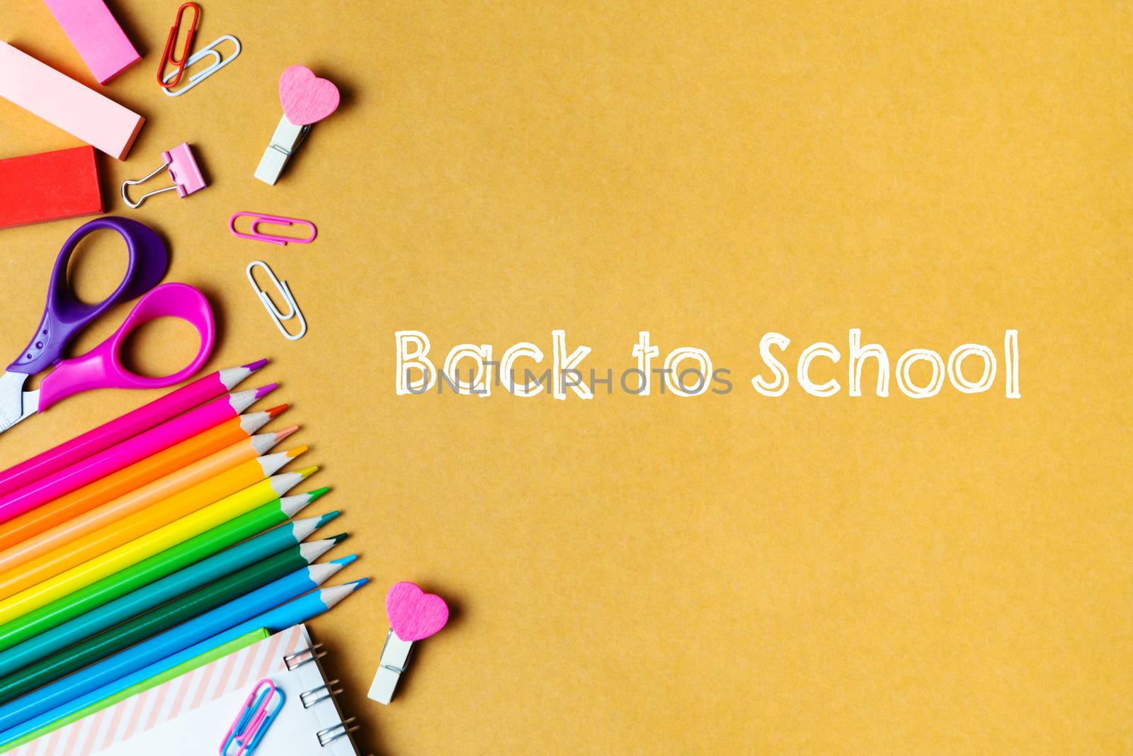 School supplies on black board background. Back to school concep by psodaz