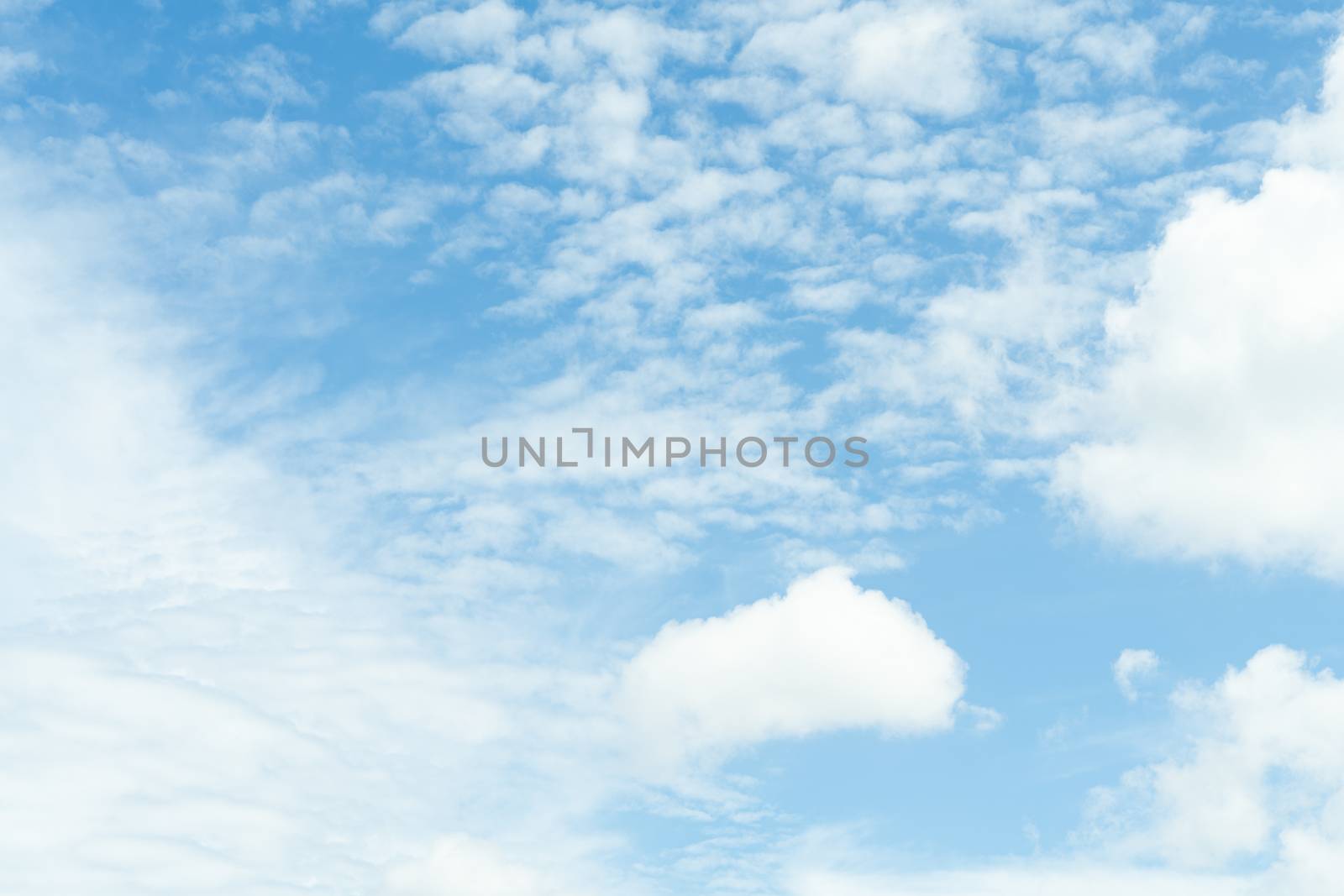 white soft cloud texture on blue sky backdrop