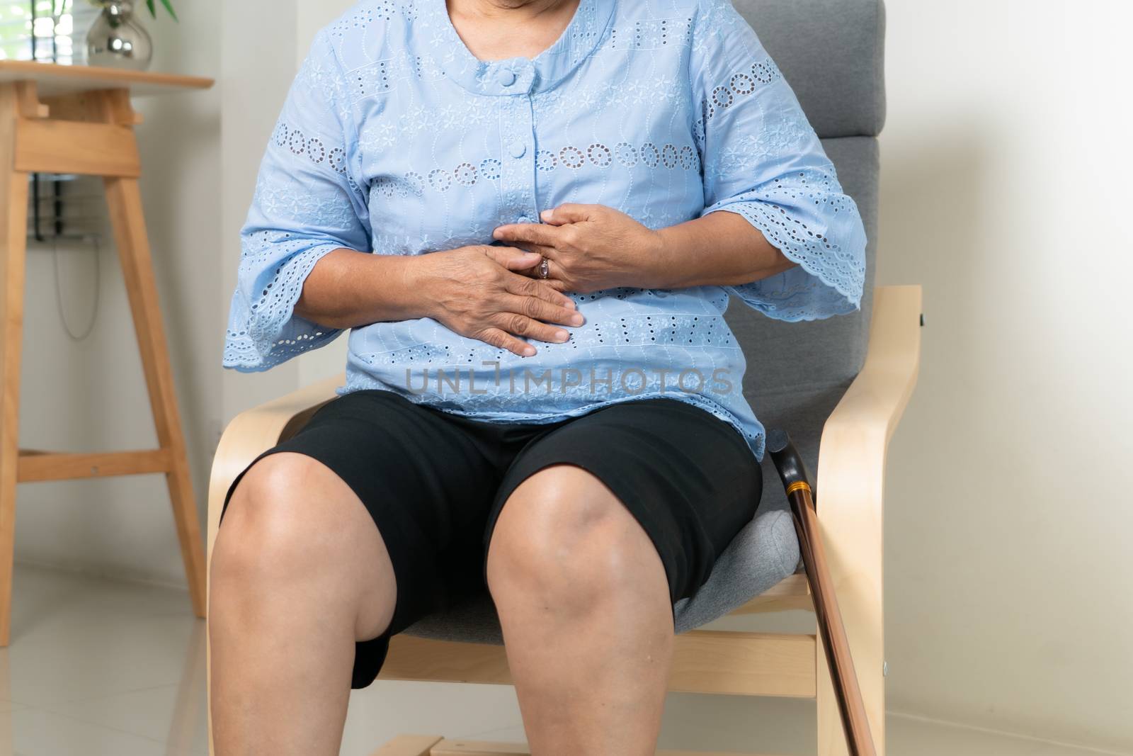 Senior woman Suffering From Acid Reflux Or Heartburn-Isolated On White Background