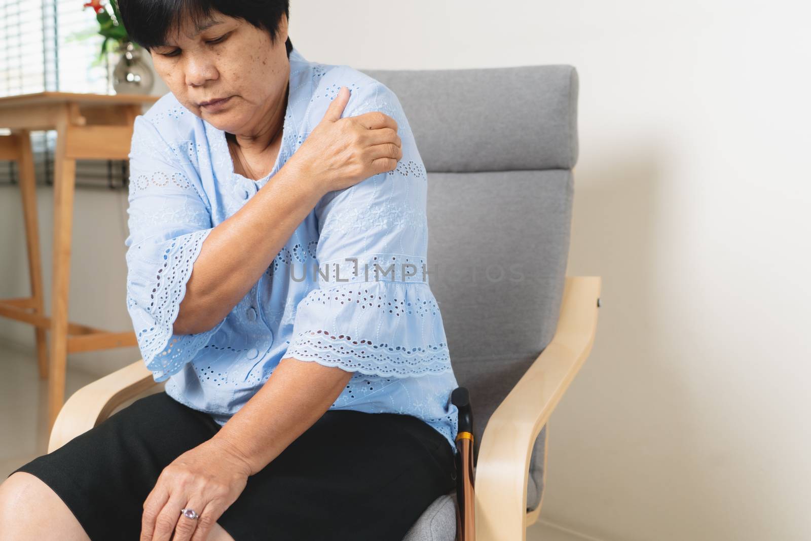 neck and shoulder pain, old woman suffering from neck and shoulder injury, health problem concept