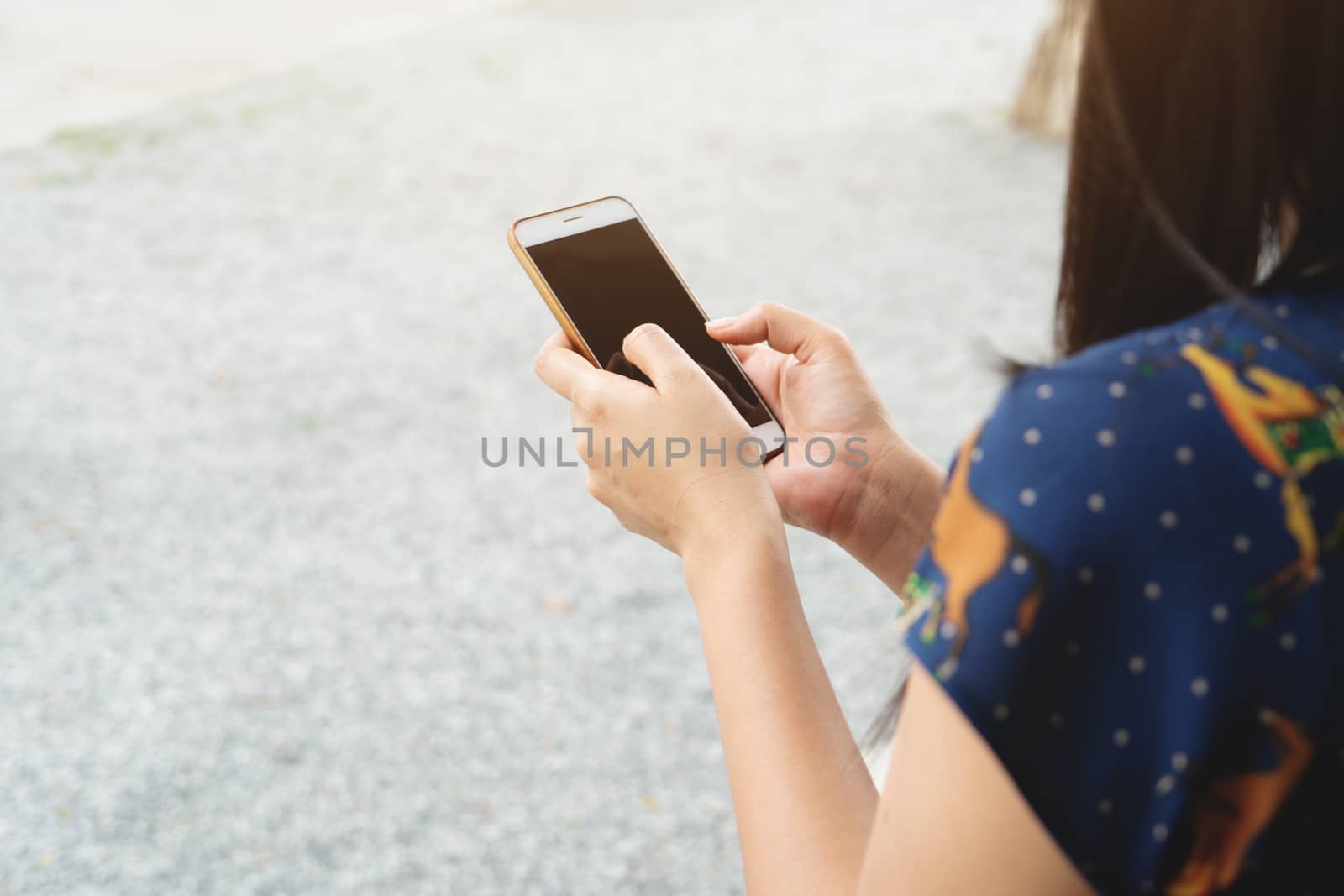 hand holding smartphone searching information on blurred background