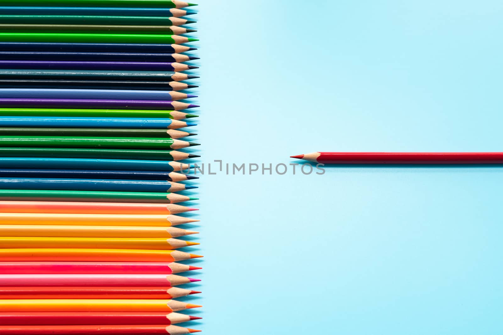 Leadership business concept. Red color pencil lead presentation to other color