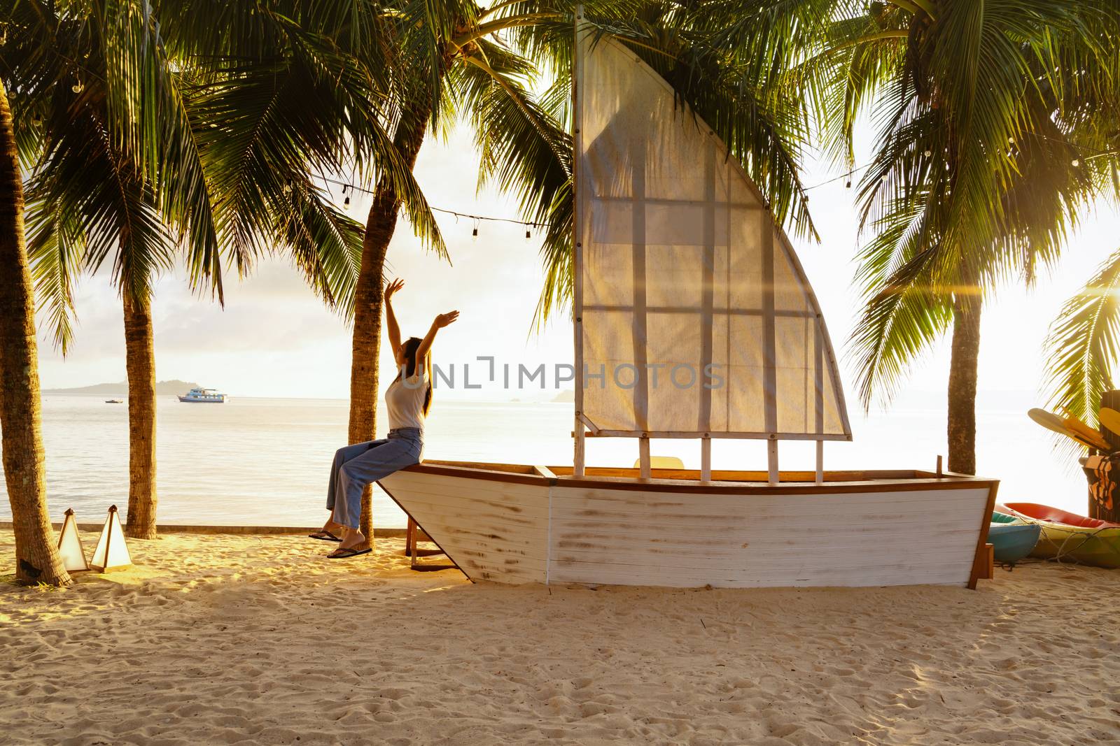 Beautiful girl enjoy the morning sunrise on the  beach font near the sea. Summer holiday and vacation concept