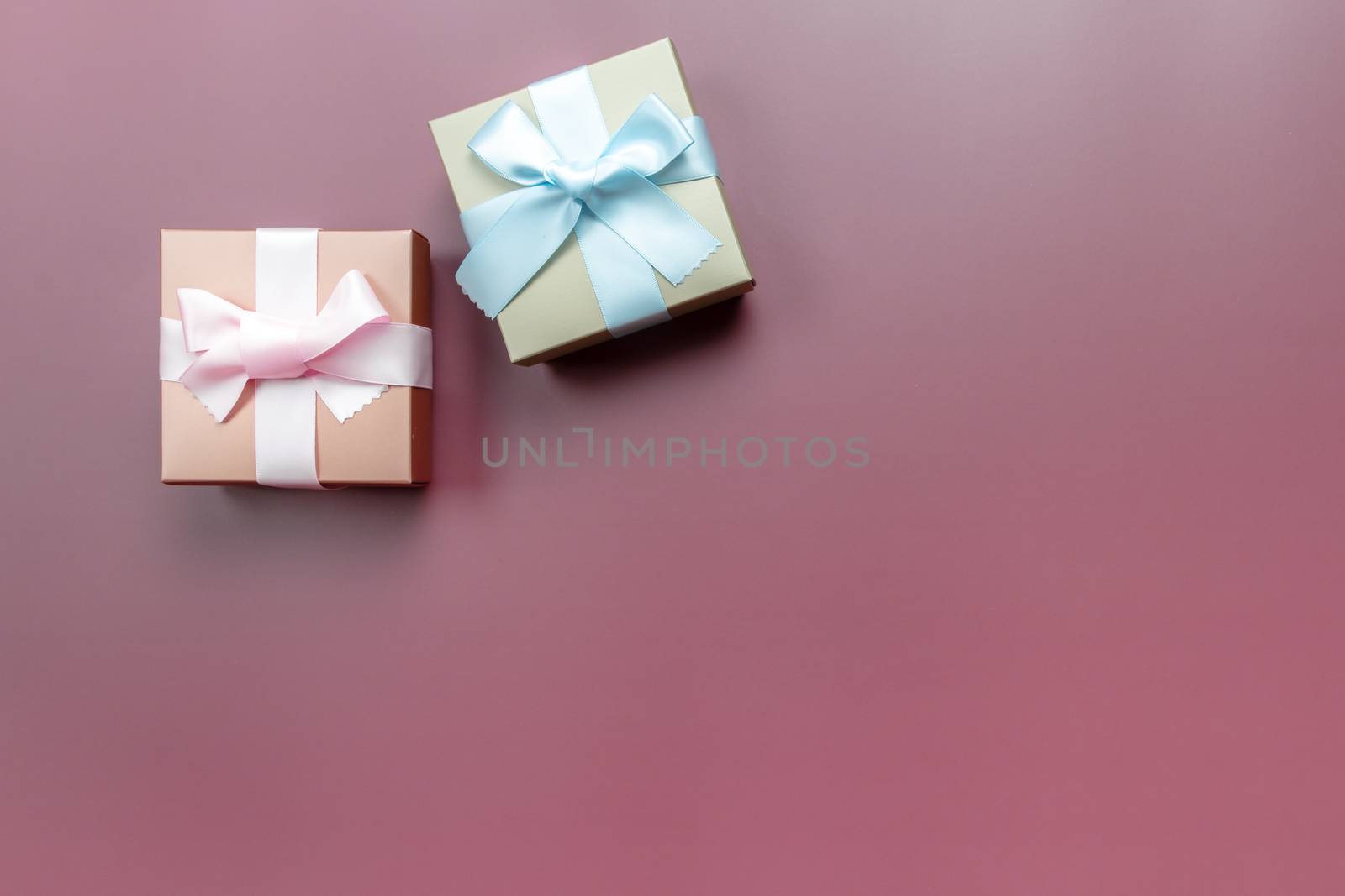 Two gift box on pink background for special day