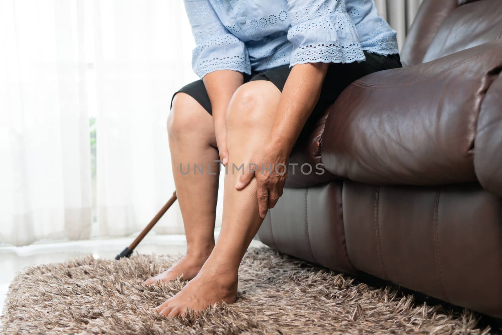 Leg pain of senior woman at home, healthcare problem of senior concept