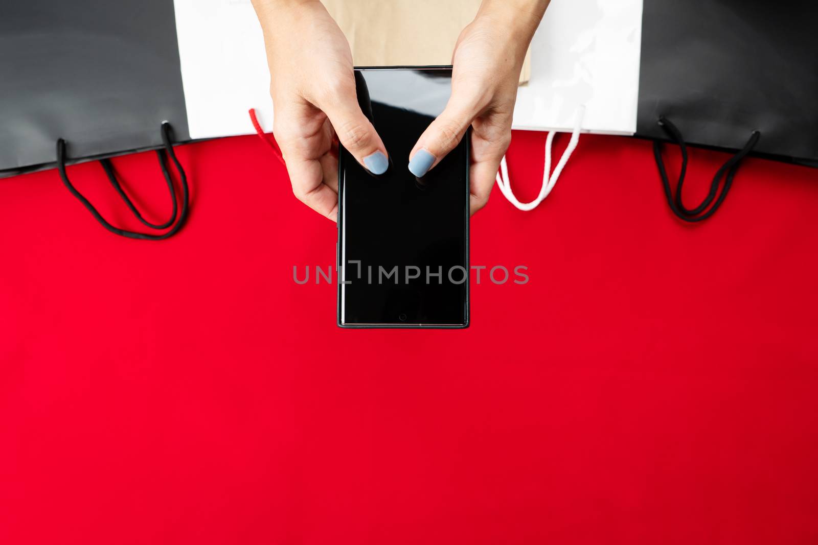 black friday sale, woman hand online shopping on smartphone with by psodaz
