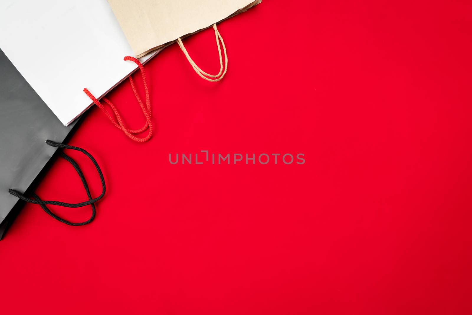 black friday sale, shopping bag on red background by psodaz