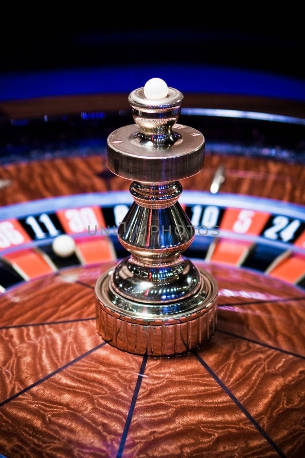 Roulette wheel in casino, gambling ads