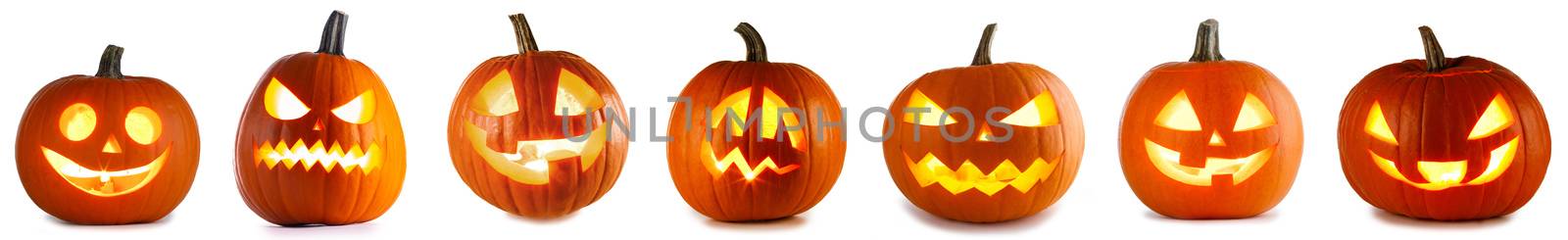 A collection of Jack O Lantern Halloween pumpkins with various different designs isolated on white background