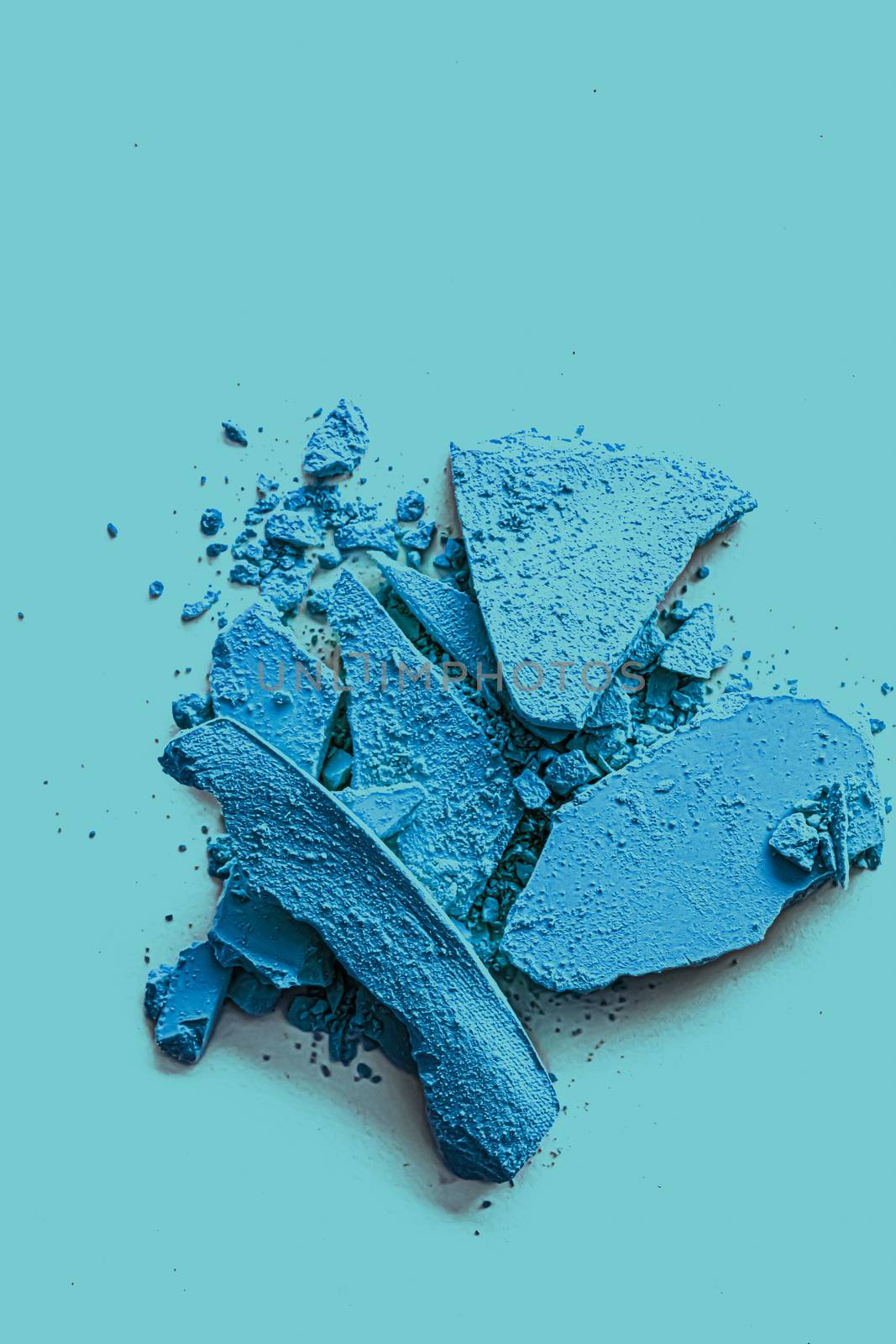 Blue eye shadow powder as makeup palette closeup, crushed cosmetics and beauty texture by Anneleven
