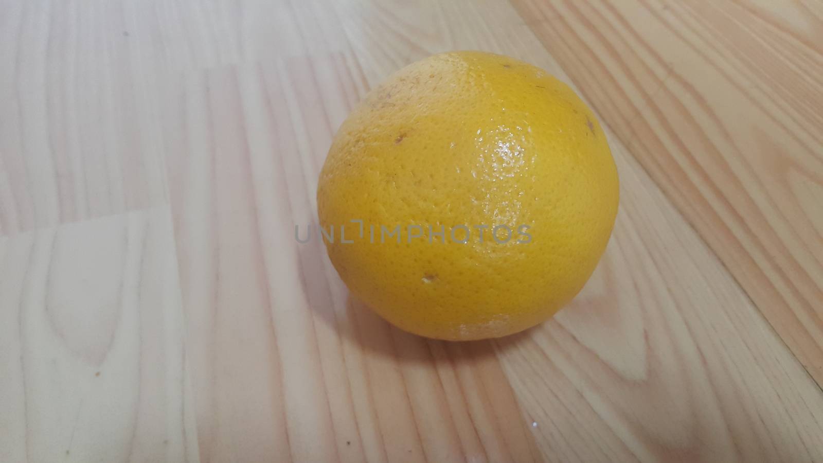 Close up view of oranges on wooden floor with wooden background. Fruit with wood background. Healthy benefits of Orange. 