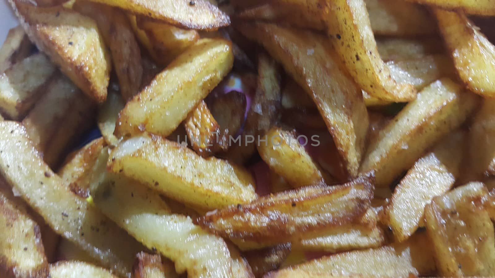 Potato fried or roasted slices on clean background with copy space for text