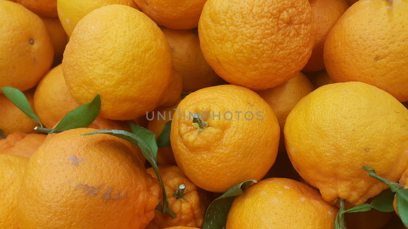 Healthy, fresh organic oranges in supermarket for sale, pile of orange in market for texture