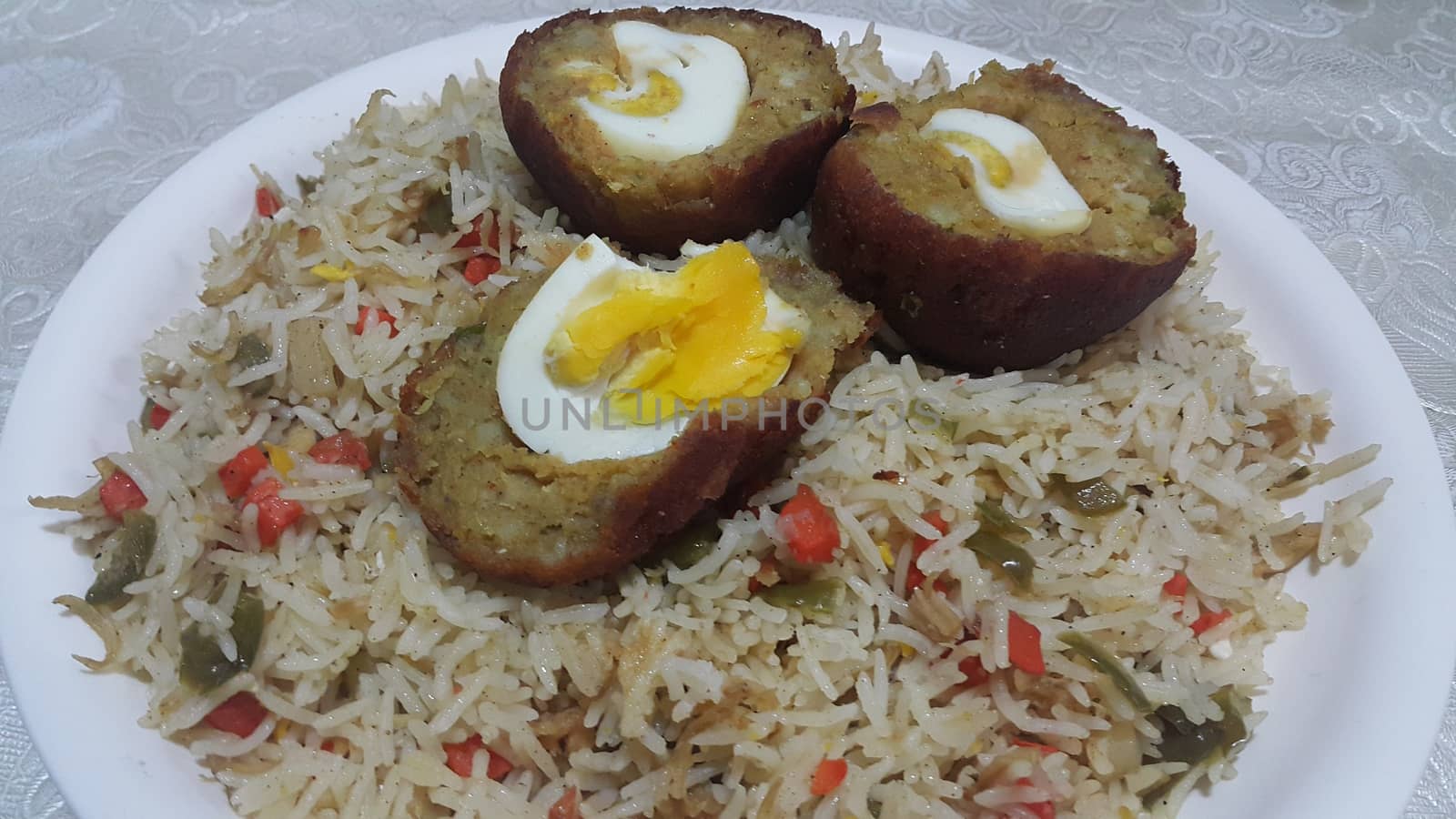 Top view of meat balls or meat kofta curry in Basmati rice pulao or pulav or vegetable rice dish