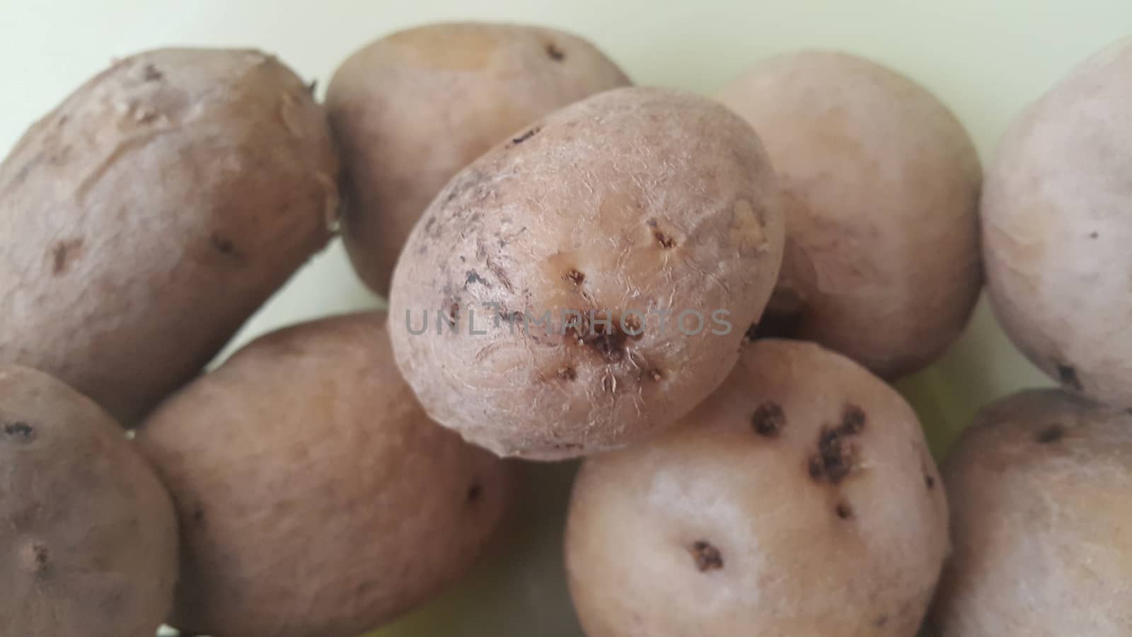  close up view of fresh organic potato in market:  Food background texture of raw potatoes