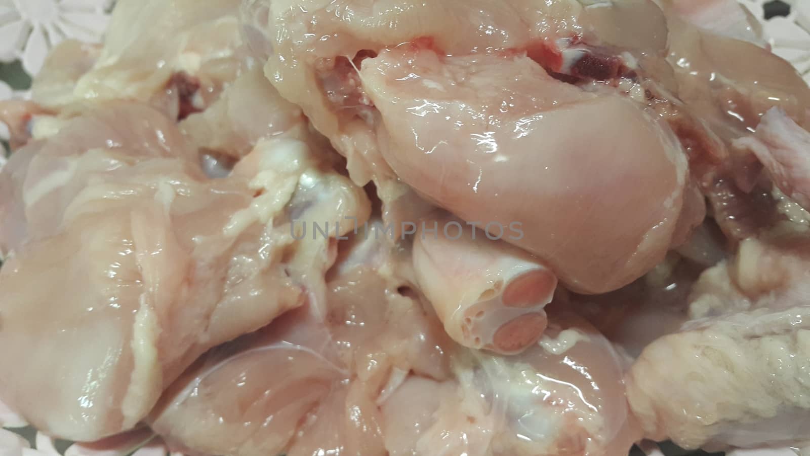 Chicken meat: Close up view of raw, fresh, choped and sliced chicken meat in grocery store use for food and ingredient background. 