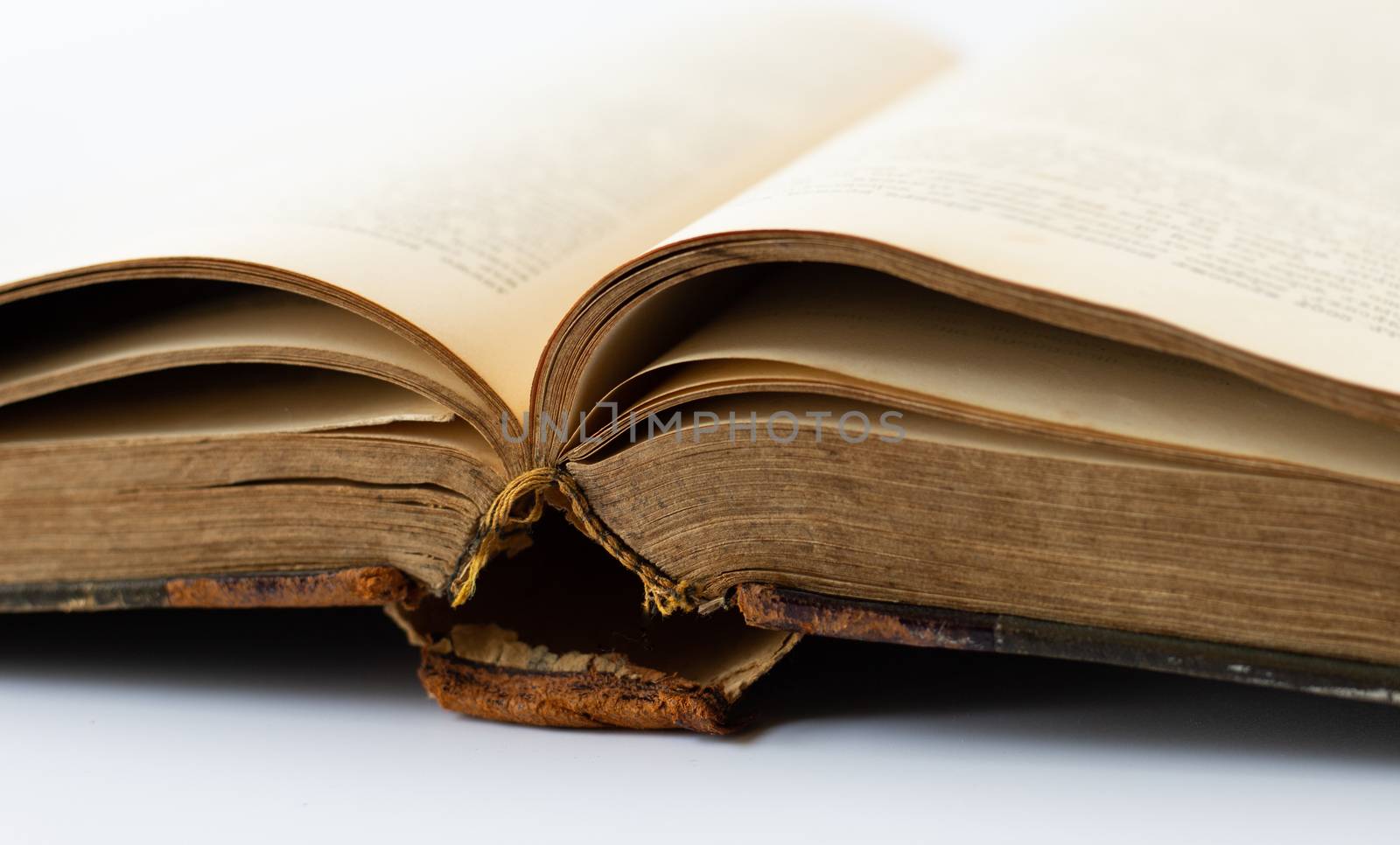 Old antique brown leather cover book on white background.