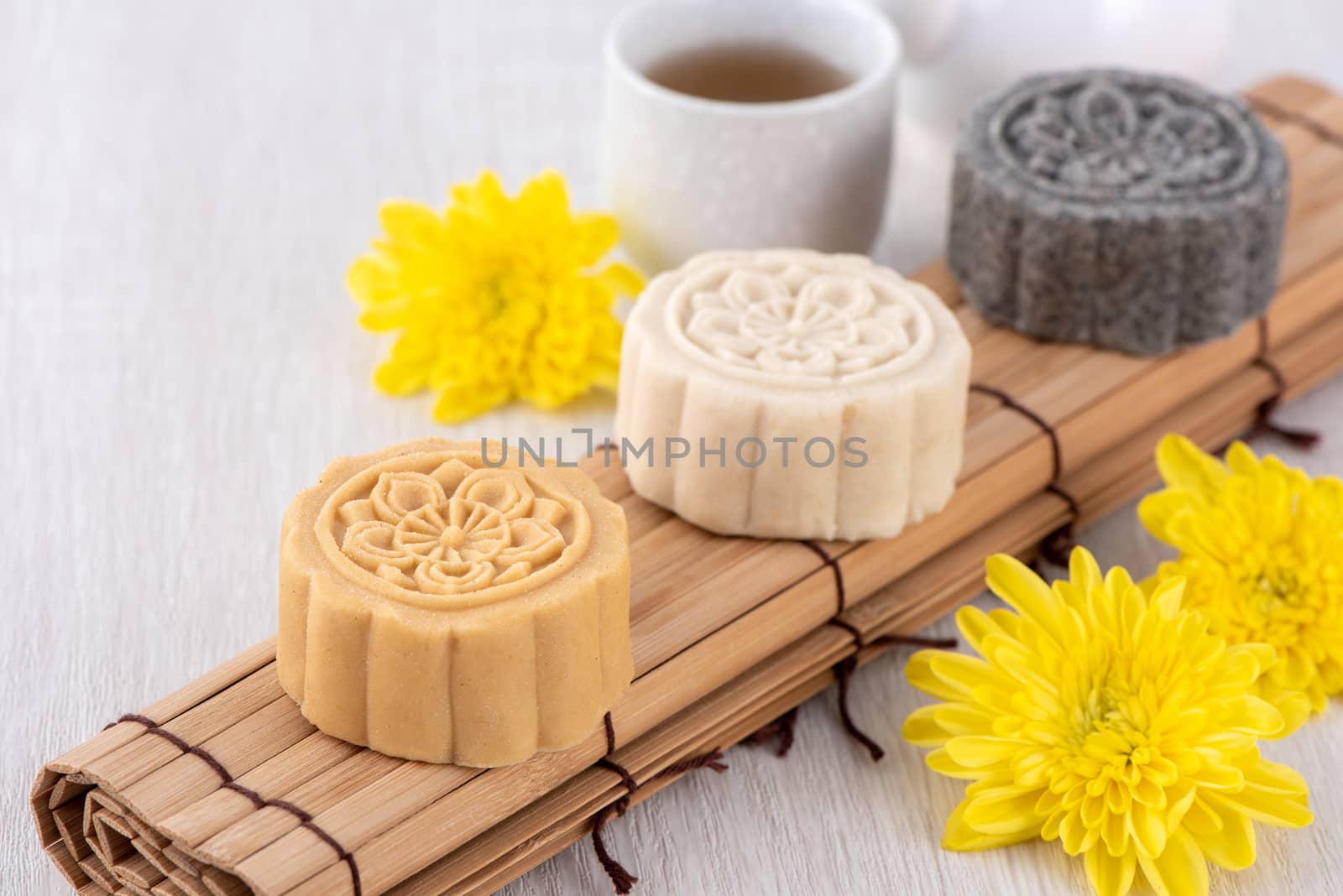 Colorful beautiful moon cake, mung bean cake, Champion Scholar Pastry cake for Mid-Autumn festival traditional gourmet dessert snack, close up.