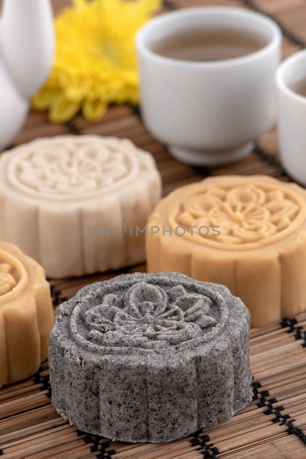 Colorful beautiful moon cake, mung bean cake, Champion Scholar Pastry cake for Mid-Autumn festival traditional gourmet dessert snack, close up.