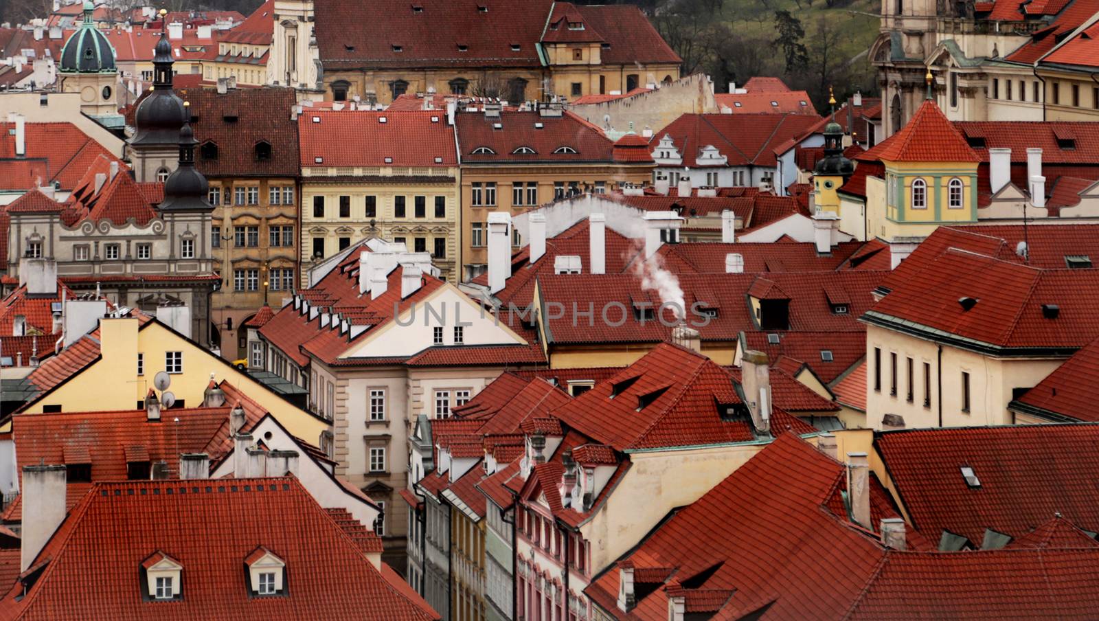 Top view to red roofs skyline of Prague city, Czech Republic. Aerial view of Prague city with terracotta roof tiles, Prague, Czechia. Old Town architecture with terracotta roofs in Prague.