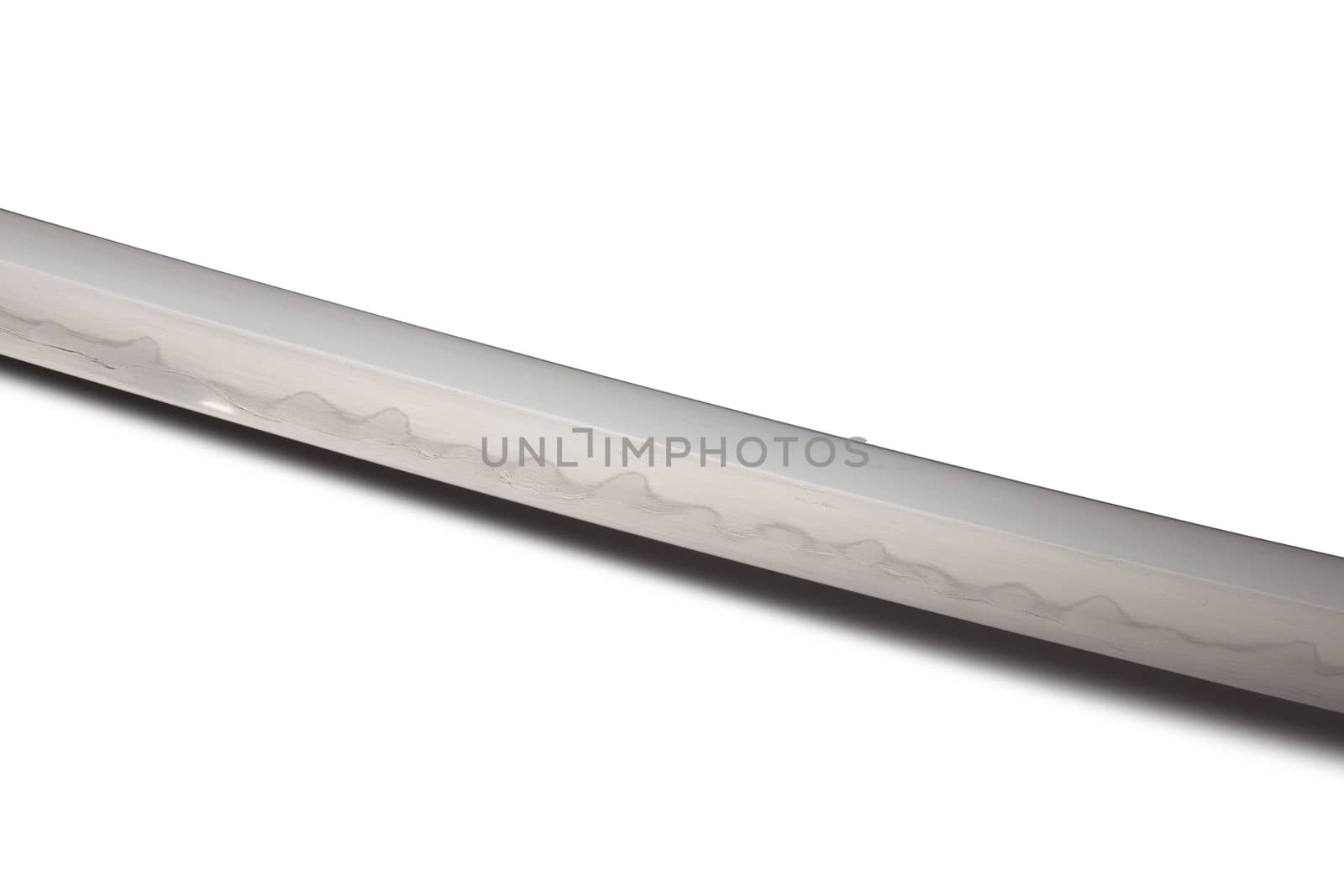 Japanese sword blade (made in China) on white background. Soft focus The blacksmith forged several folds until several layers were formed. Can be seen clearly on the surface.