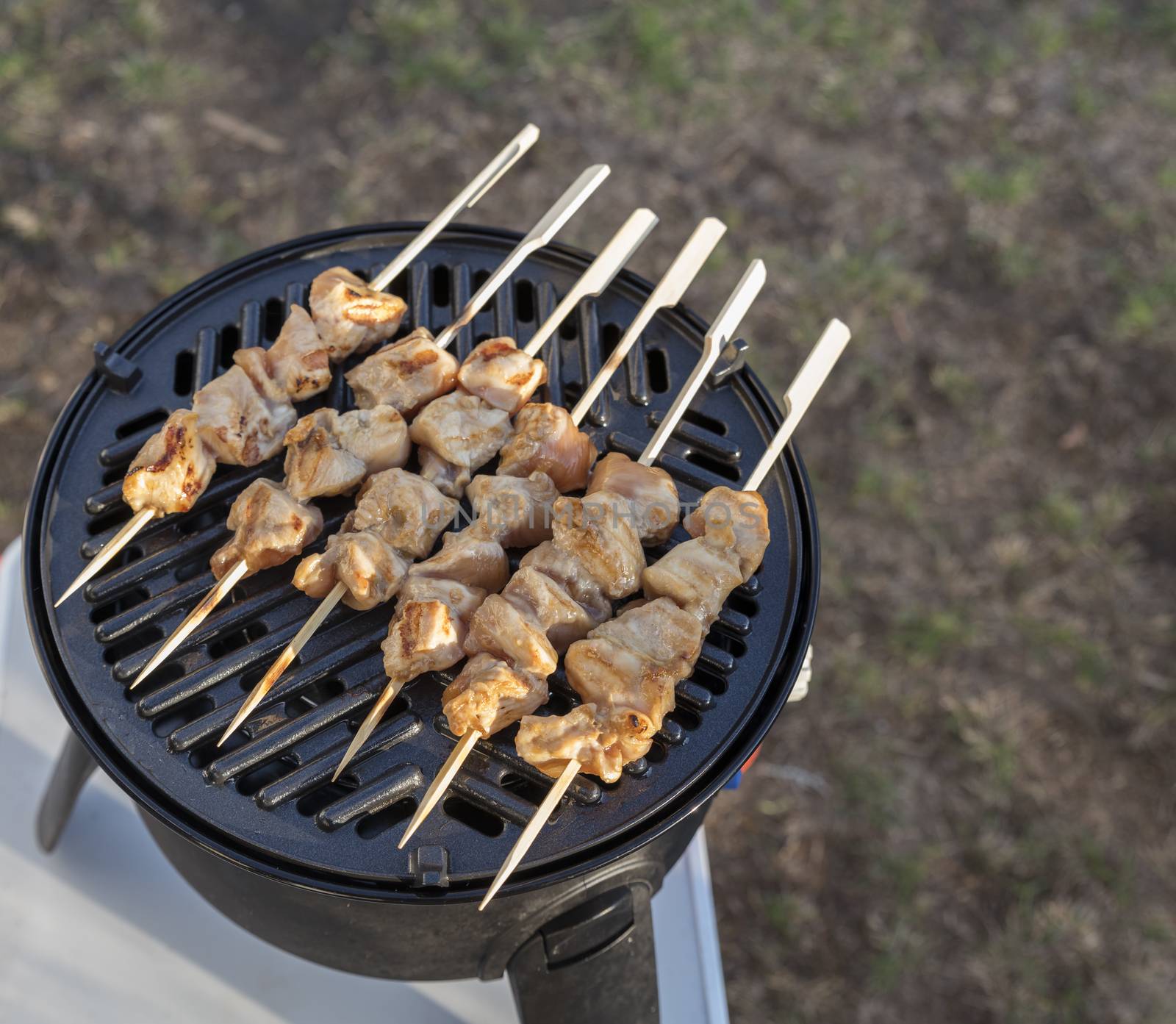 outdoor camping gas bbq with grill plate for a nice chicken sate