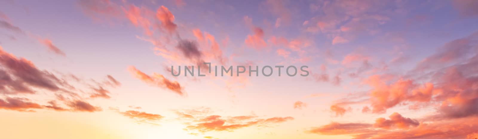 Colorful orange-purple dramatic clouds lit by the setting sun ag by Eugene_Yemelyanov
