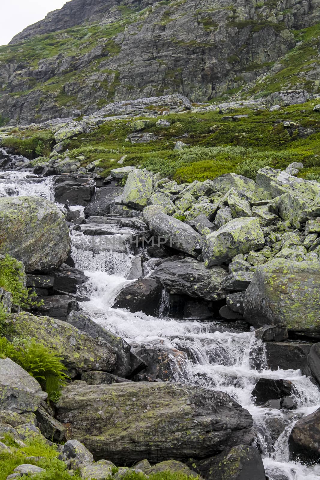 Hydnefossen waterfall and Hydna river on Veslehødn Veslehorn mountain in Hemsedal, Norway.