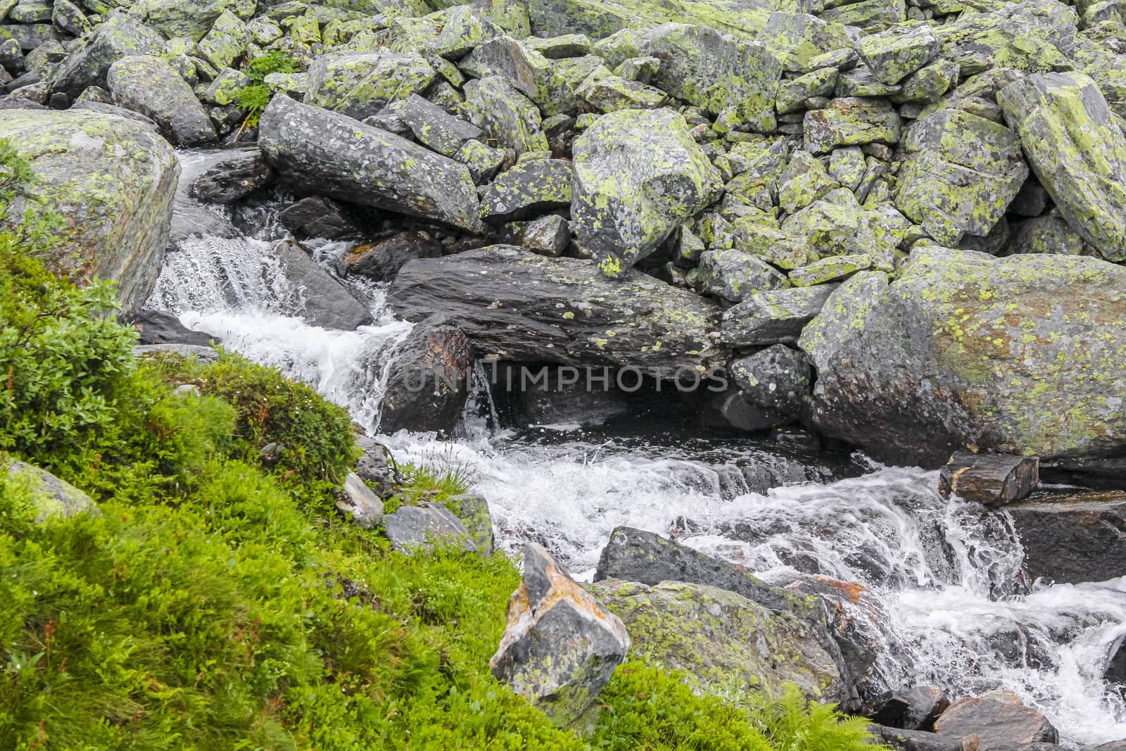 Hydnefossen waterfall and Hydna river on Veslehødn Veslehorn mountain in Hemsedal, Norway.