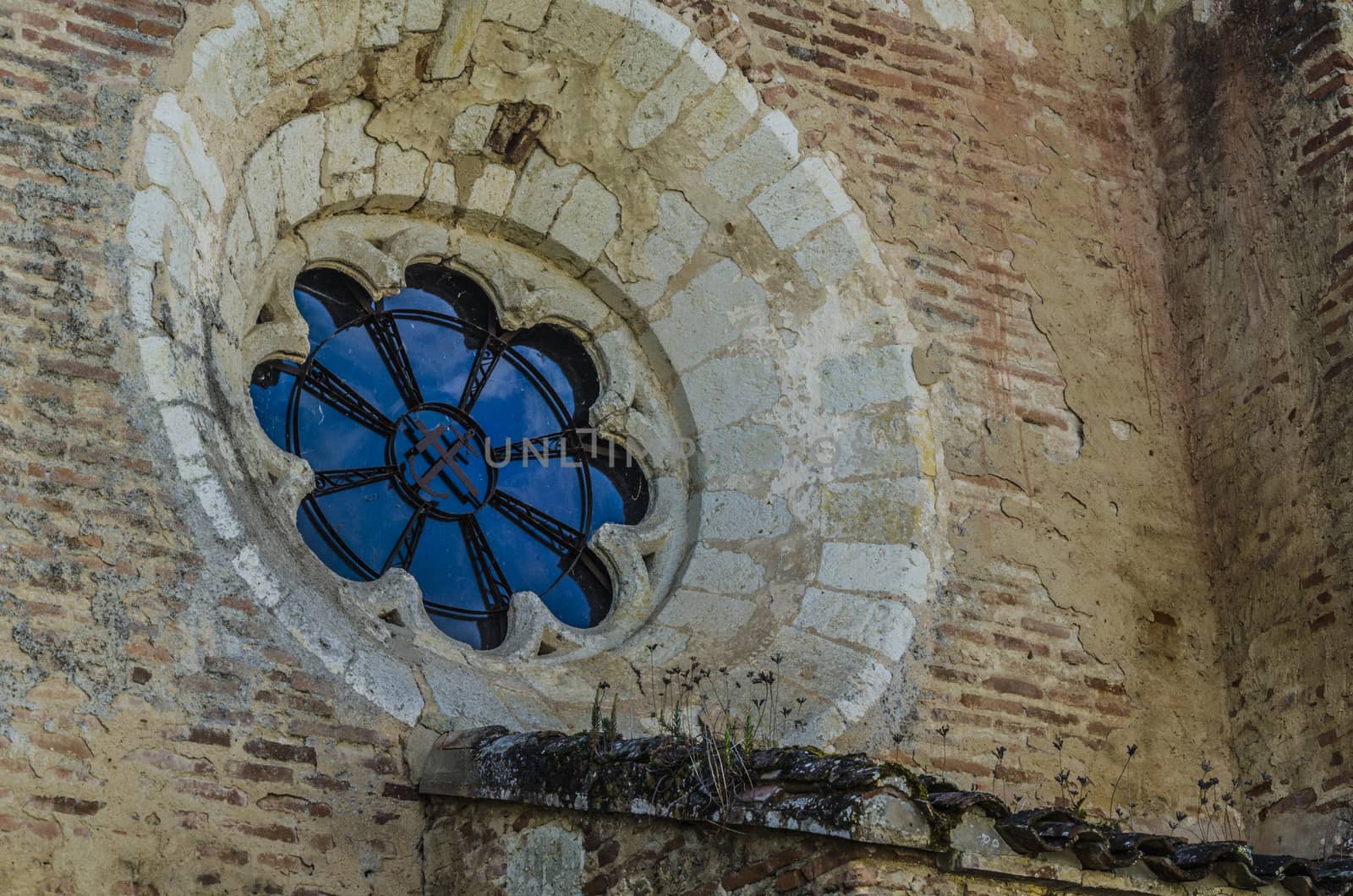 Detail of chapel window in the port of the medieval village of Auvillar, near the river Garonne, France.