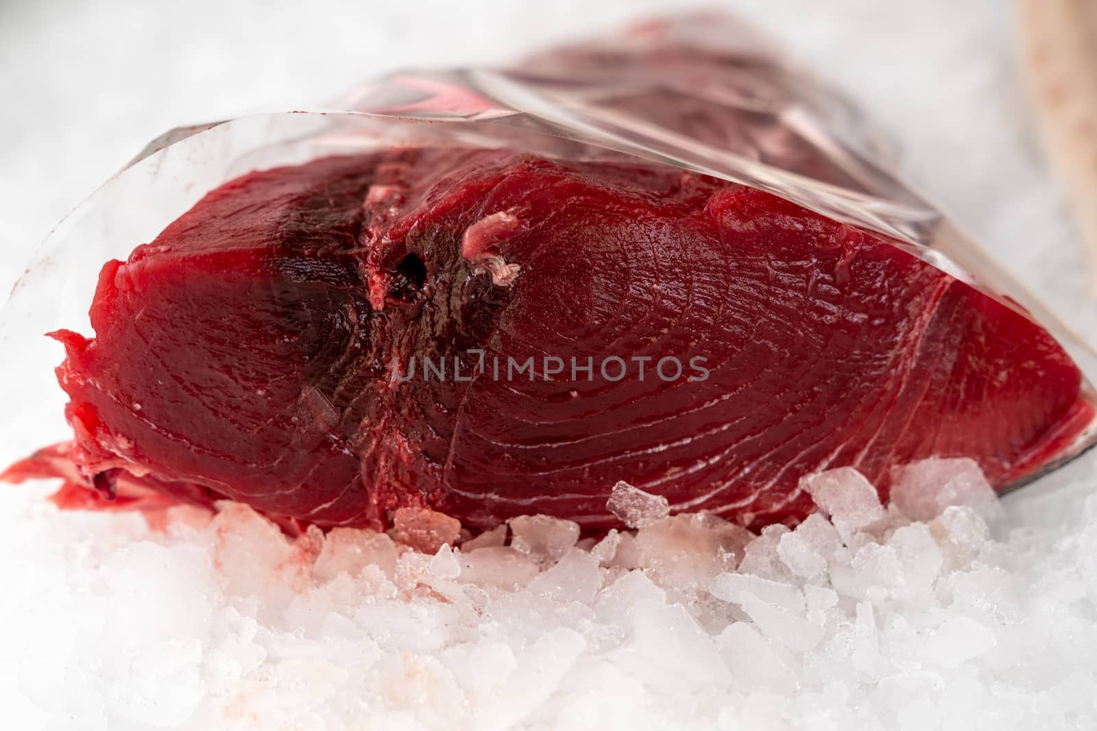 piece of red tuna on ice background,close up,typical fish of the Mediterranean sea , caught in Sicily.