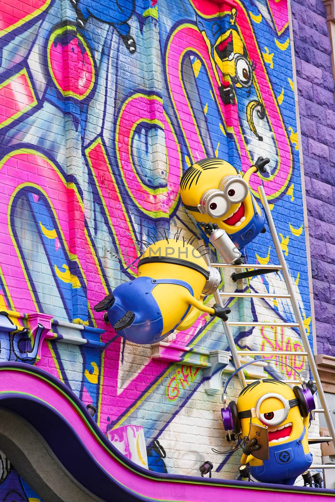 OSAKA, JAPAN - Nov 13, 2019 : Close up of HAPPY MINION statue in Universal Studios Japan. Minions are famous character from Despicable Me animation.