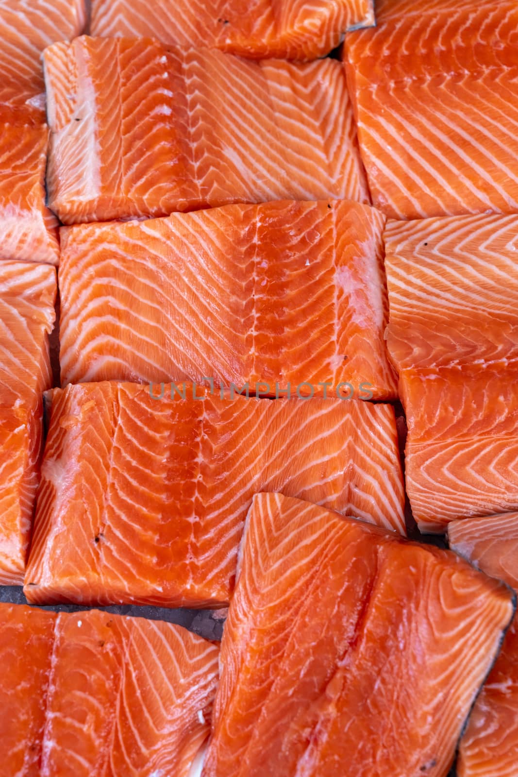 Raw Salmon Fillets on Ice for Sale at Market