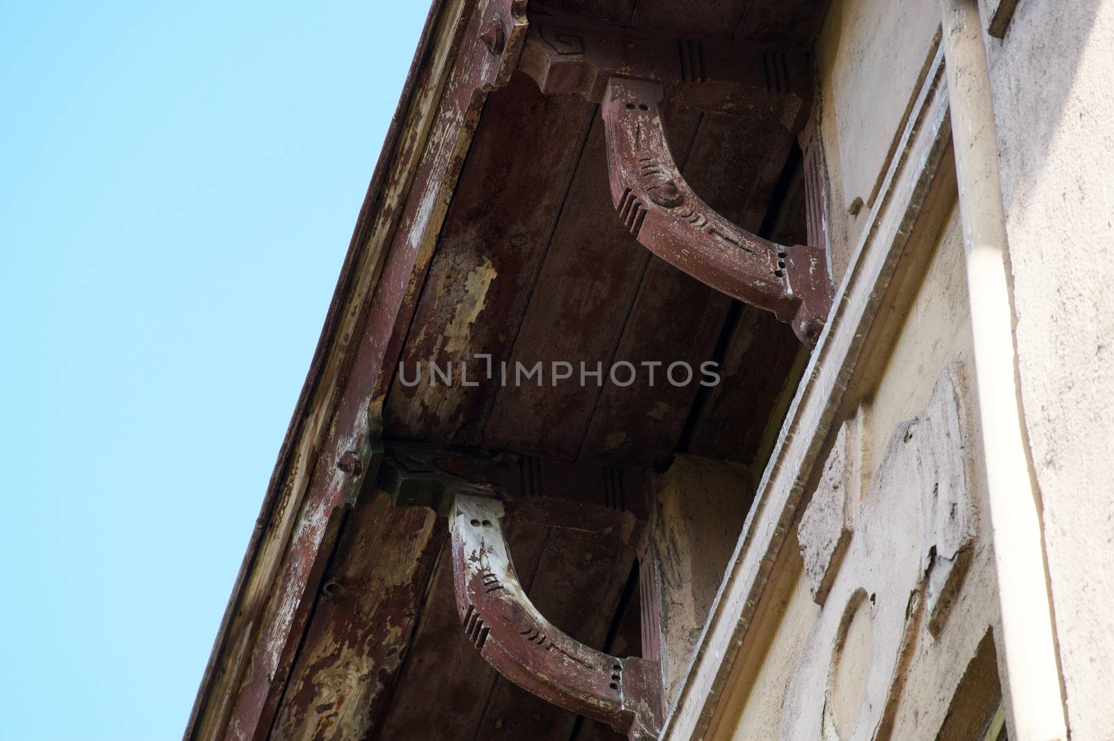 vintage wooden cornices on an ancient house close-up