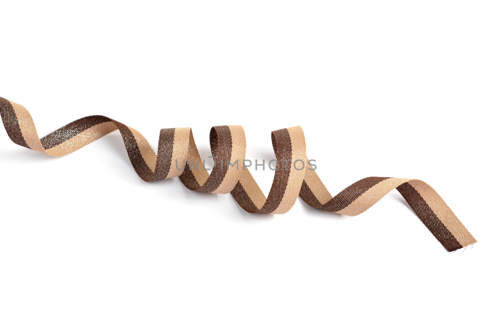 Brown beige Cotton ribbon, roll textilies on bobbin. strapping tape with curl on white backgroud. Use for sewing clothes, bags. Space for text.