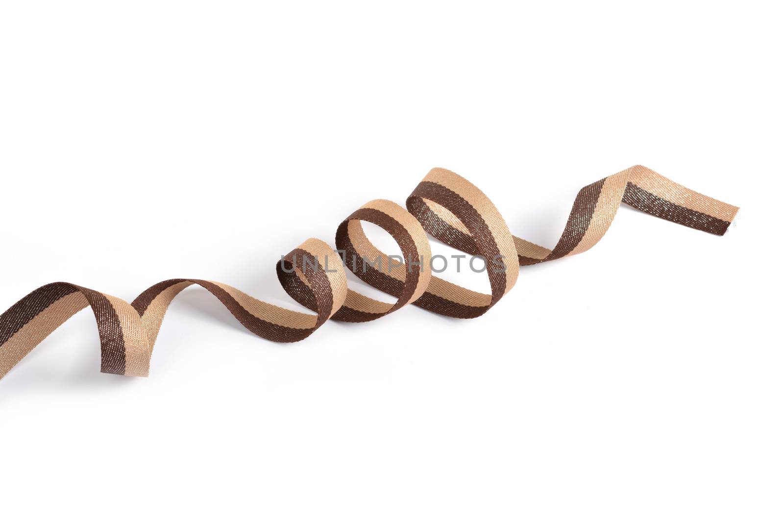 Brown beige Cotton ribbon, roll textilies on bobbin. strapping tape with curl on white backgroud. Use for sewing clothes, bags. Space for text.