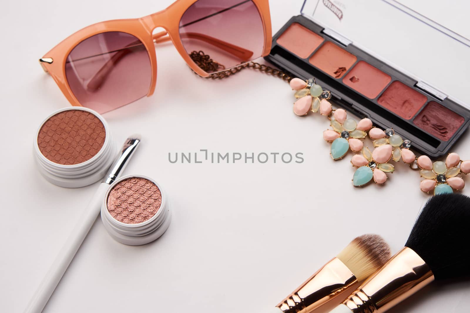 Professional cosmetics makeup brushes light background Copy Space glasses. High quality photo