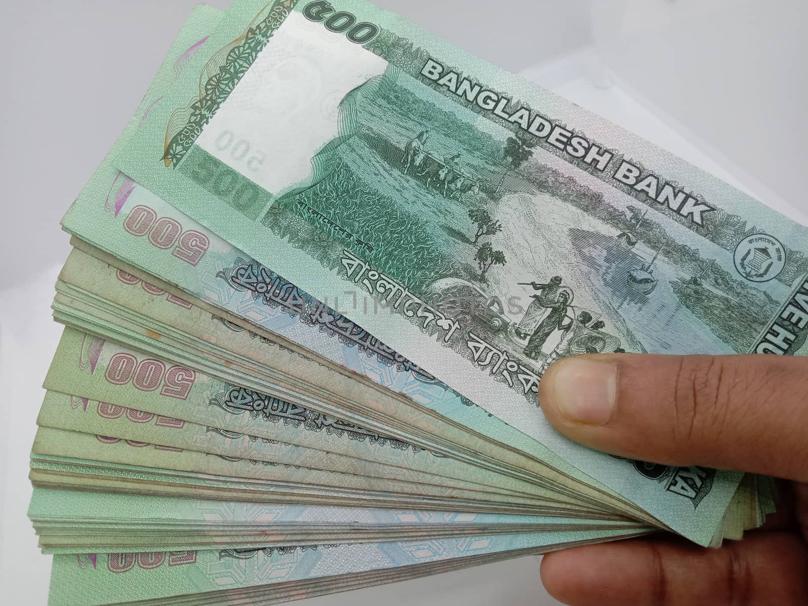 Bangladeshi 500 hundred bank note bundle on white background