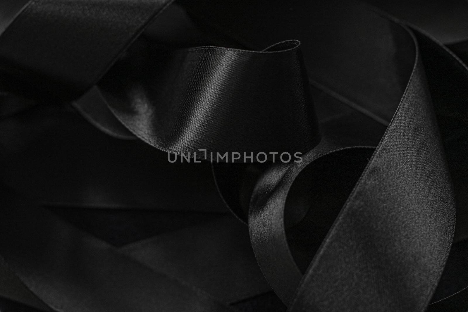 Black silk ribbon as background, abstract and luxury brand design by Anneleven