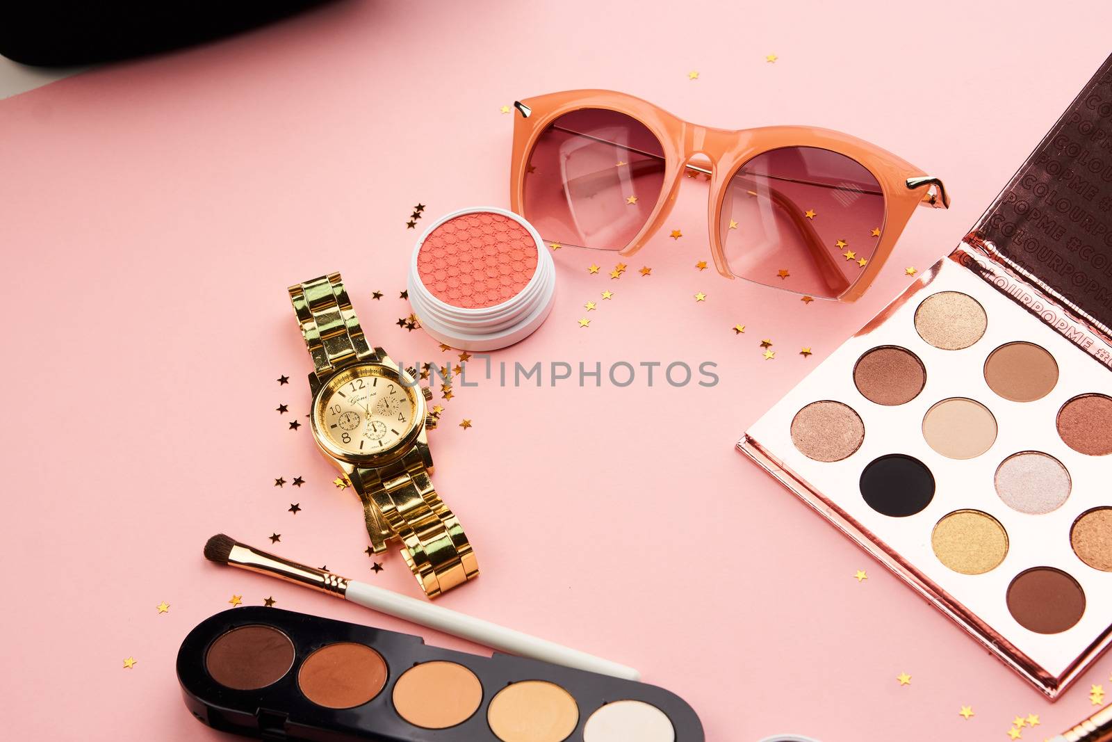 cosmetic accessories eyeshadow accessories makeup brushes merchandise collection professional cosmetics on pink background.