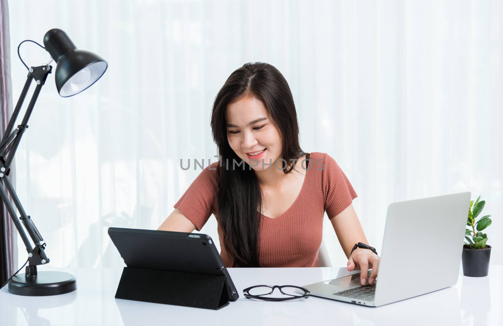 Business woman use smart tablet and laptop computer technology v by Sorapop