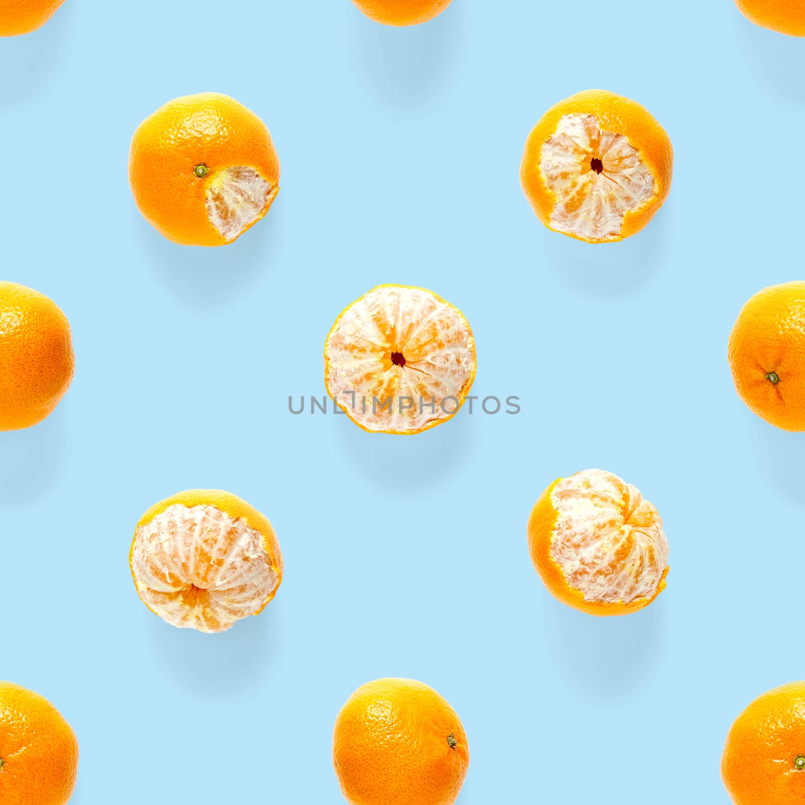 Fresh mandarin Seamles pattern. Ripe fruit tangerines seamless pattern. Fresh citrus isolated on blue background pattern. Flat lay of Clementine. Mandarine modern tropical seamless background.