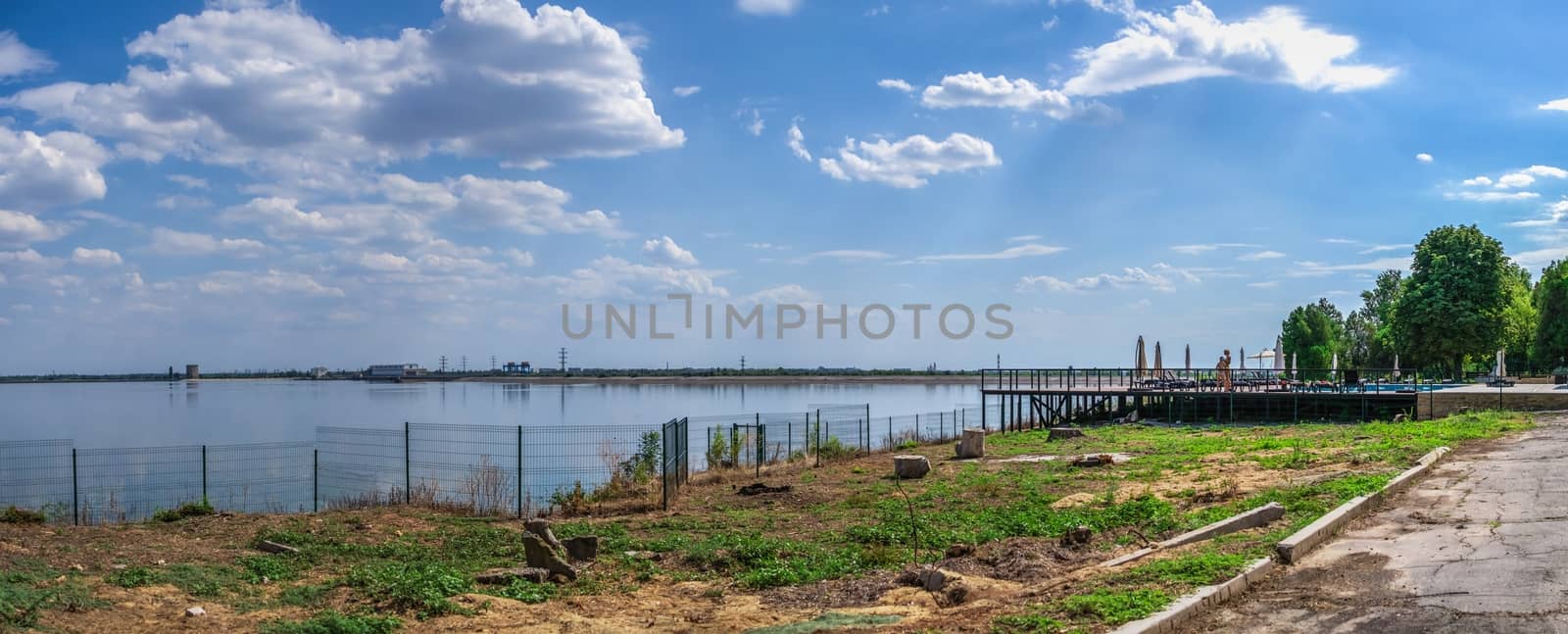 Vesele, Ukraine 07.24.2020. View of the Dnipro river and Kakhovskaya hydroelectric power station from the side of Chateau Trubetskoy in Kherson region, Ukraine, on a sunny summer day