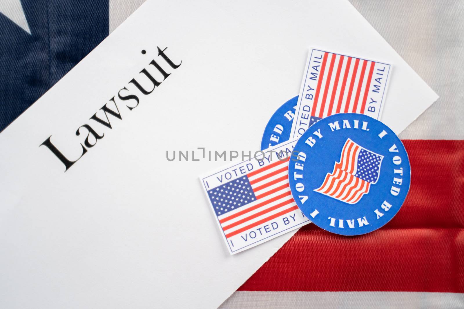 I voted by mail stickers on Lawsuit paper with US flag as background - Concept of lawsuits in USA election. by lakshmiprasad.maski@gmai.com