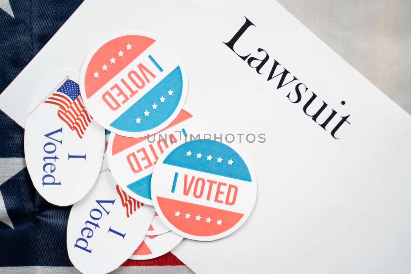 I voted stickers on Lawsuit paper with US flag as background - Concept of lawsuits in USA election. by lakshmiprasad.maski@gmai.com